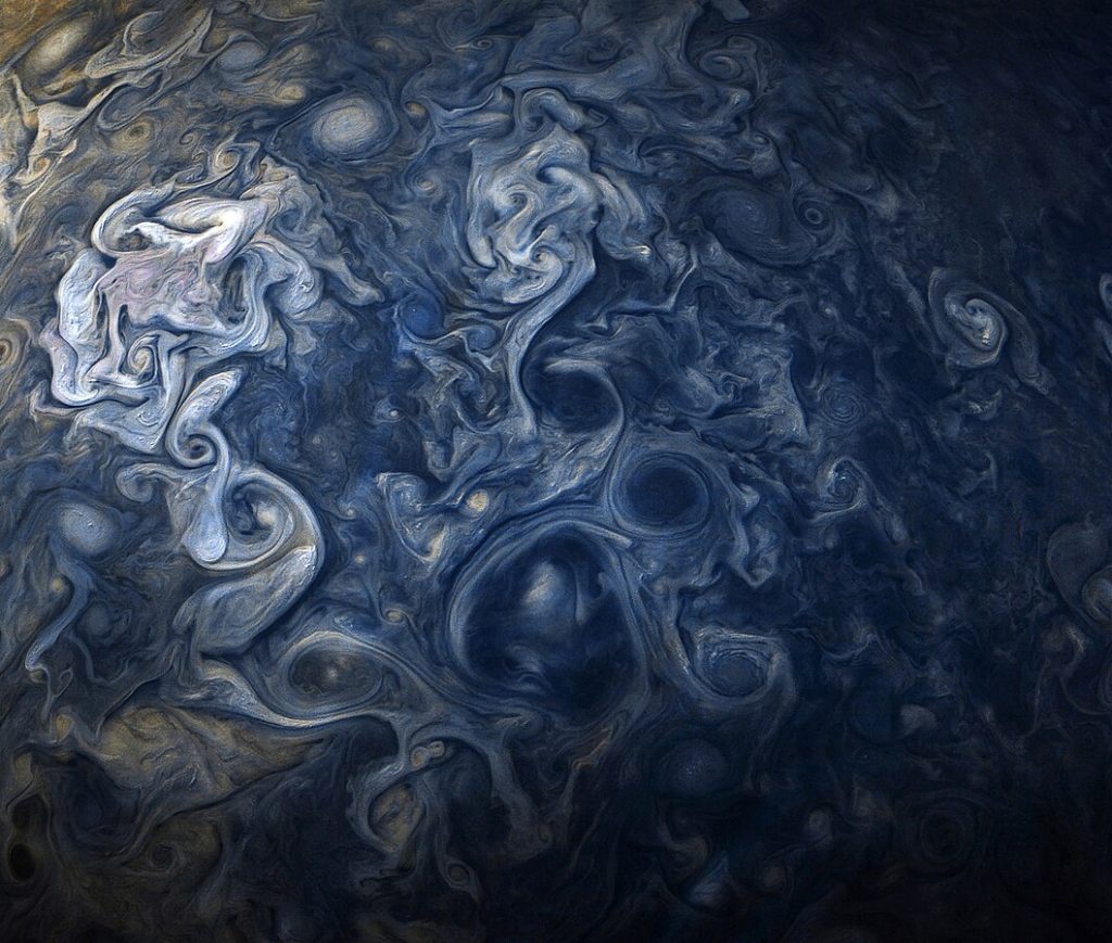 Blue Jovian clouds on Jupiter. Spirals of Blue and white in the Jovian atmosphere.