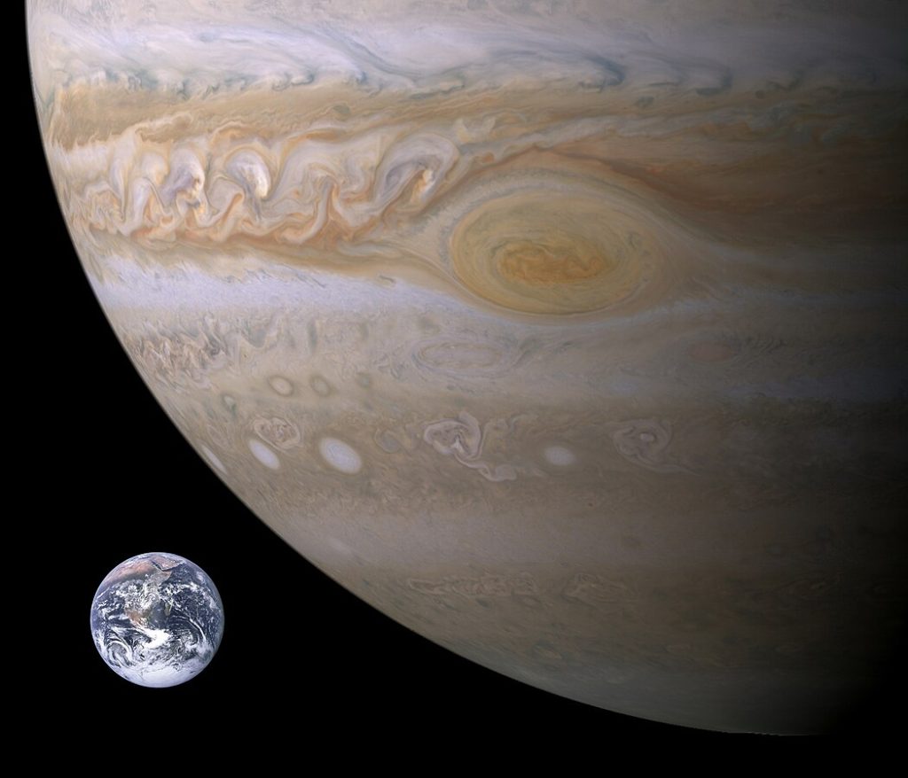 Rough visual comparison of Jupiter and Earth. Earth is in the bottom left, About 1/4 of Jupiter takes up the ramining 4/5 of the image.