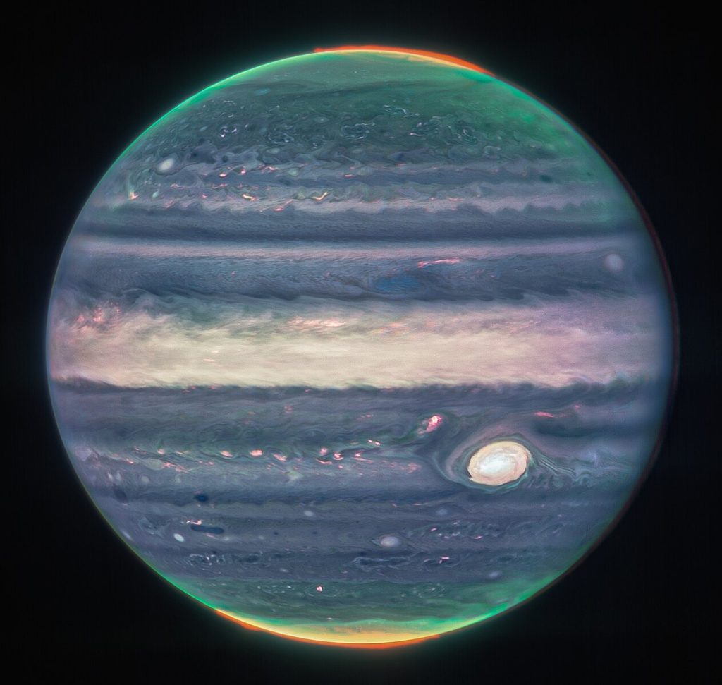 Jupiter in enhanced color, featuring the planet’s turbulent Great Red Spot, which appears white here.