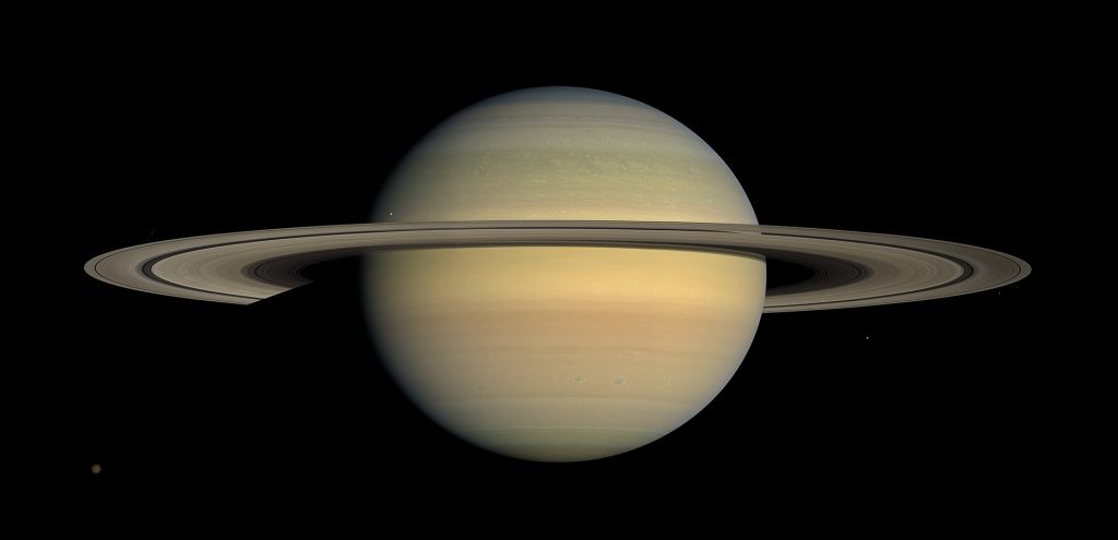 Saturn with its iconic rings, showing banded cloud layers and subtle atmospheric details.